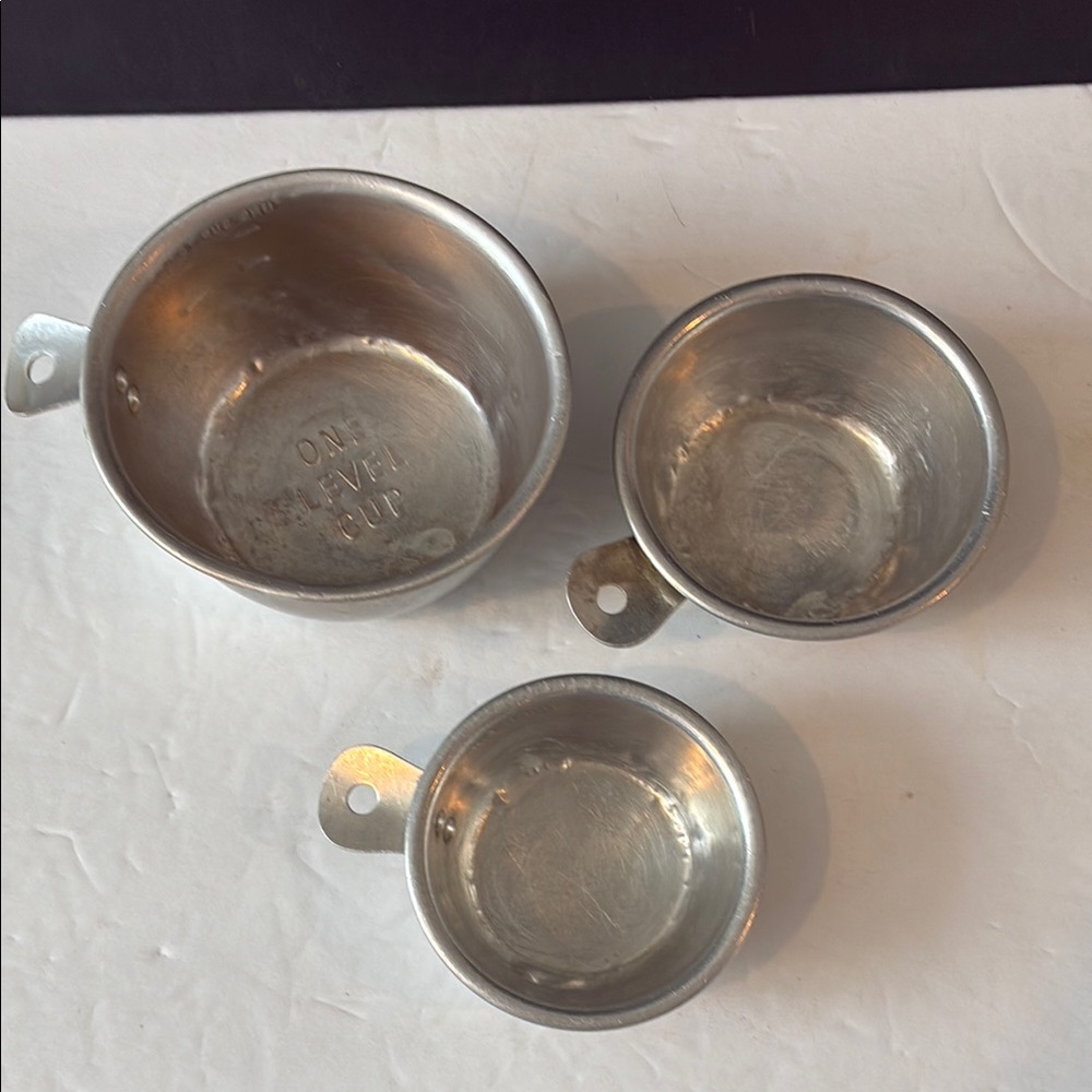 Vintage metal measuring cups. 1 cup, 1/2 cup, and 1/3 cup. Preowned